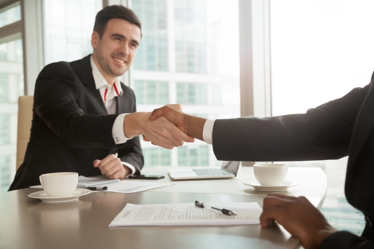 smiling man shaking hand